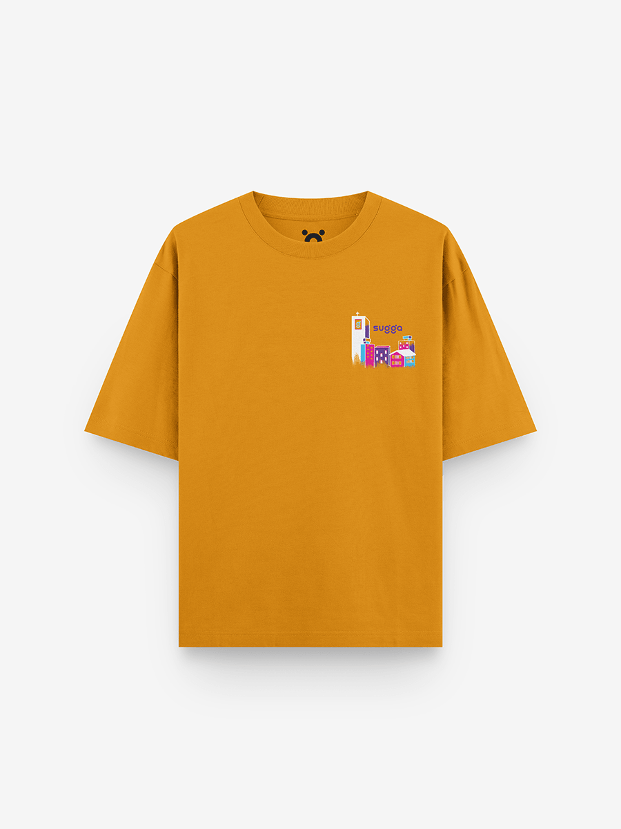 Mustard yellow streetwear t-shirt with colorful cityscape graphic on chest, urban fashion style