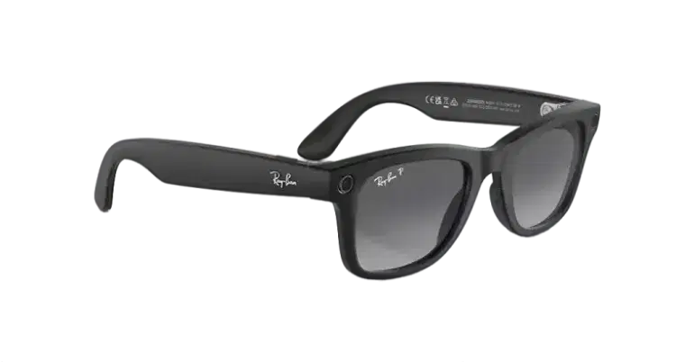 Black polarized designer sunglasses with dark lenses on a gray background