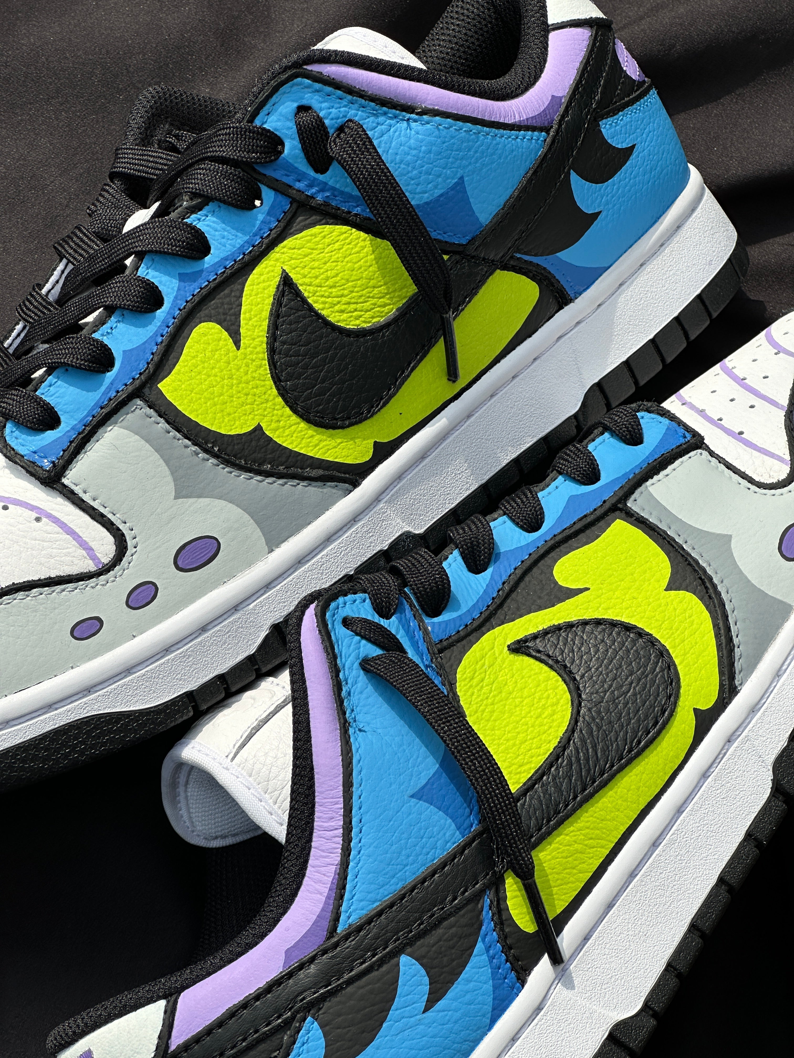 Colorful streetwear sneakers with blue, yellow, and purple graphic design details