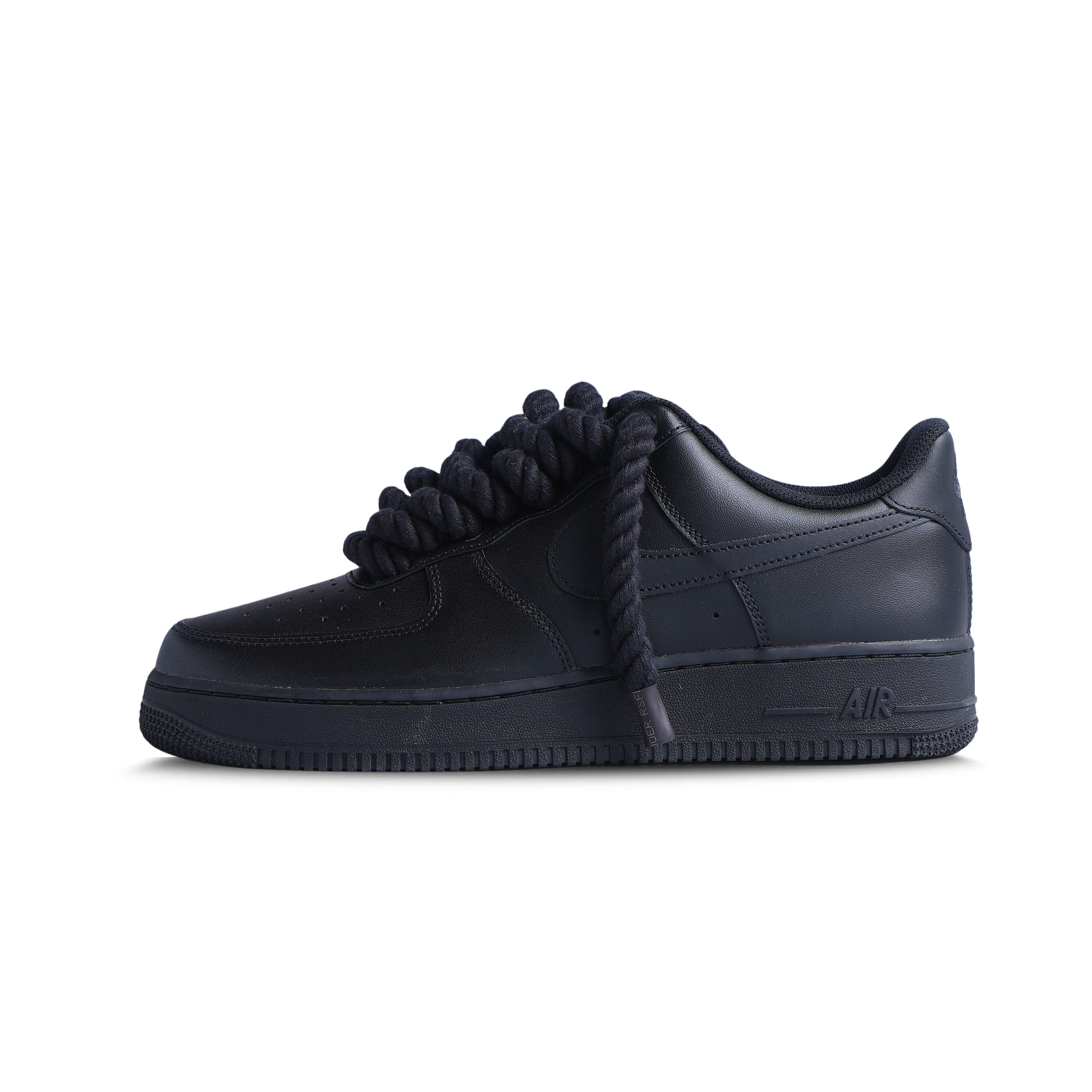 Black low-top sneaker with thick rope laces, streetwear-inspired design on white background