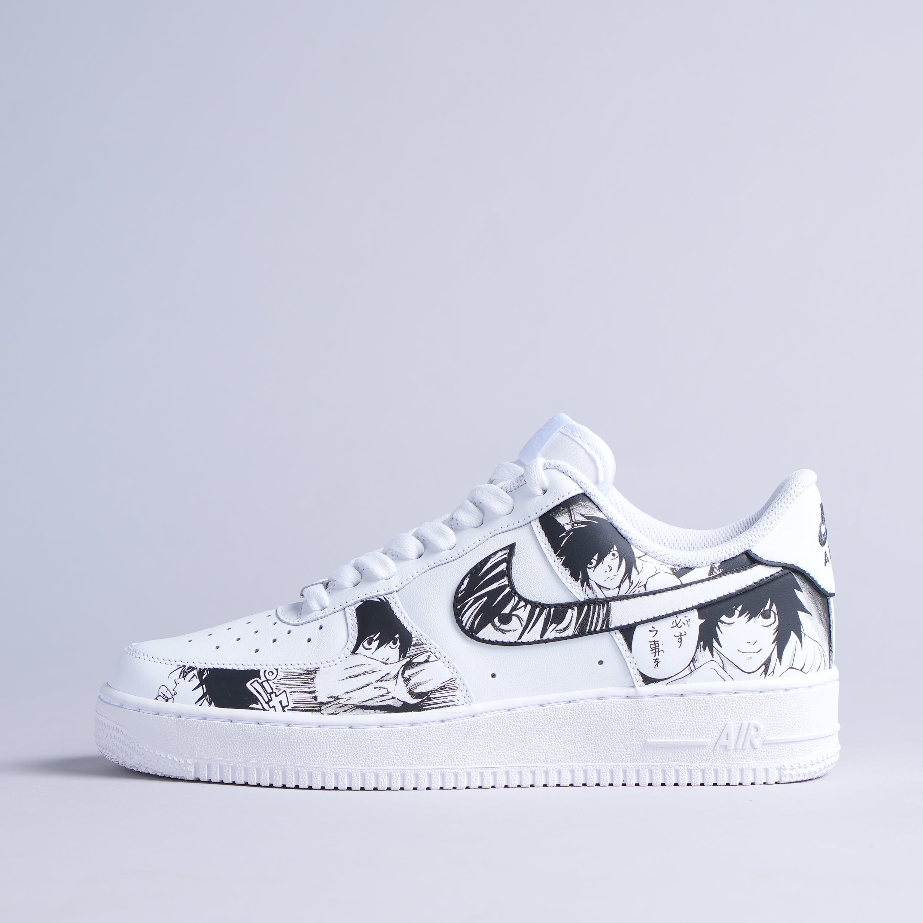 White streetwear sneaker with black and white anime graphics, side profile, clean background