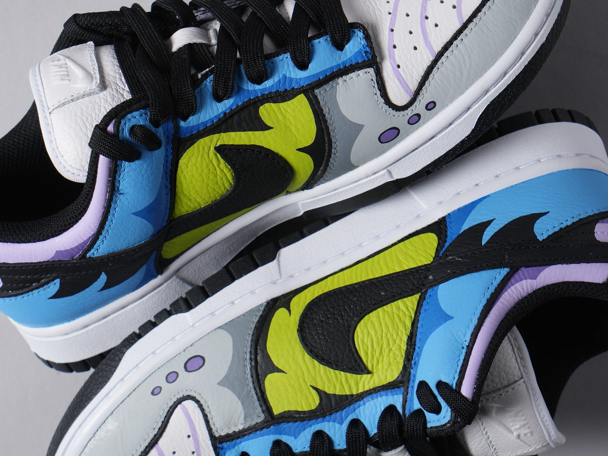 Colorful streetwear sneakers with black swoosh, blue, yellow, and purple graphic details