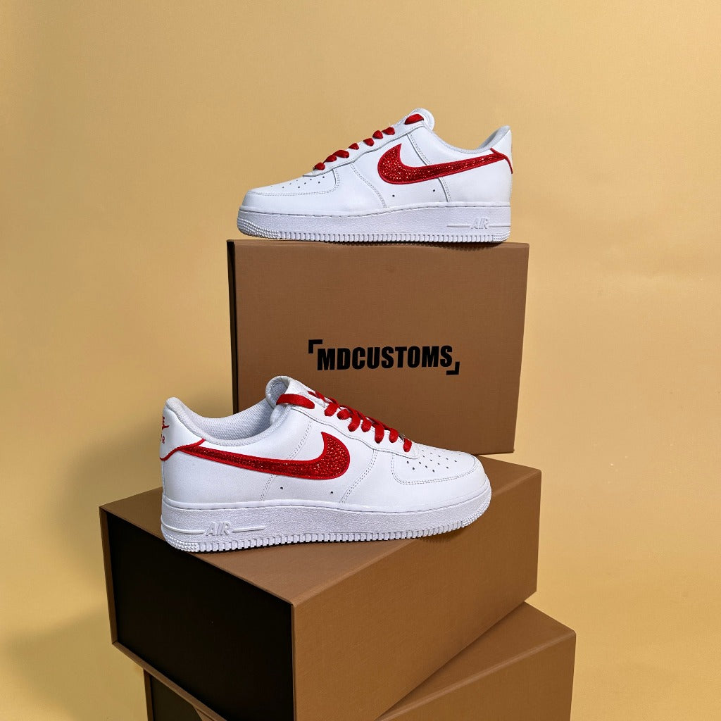 White custom sneakers with red swoosh and laces on brown boxes, streetwear footwear