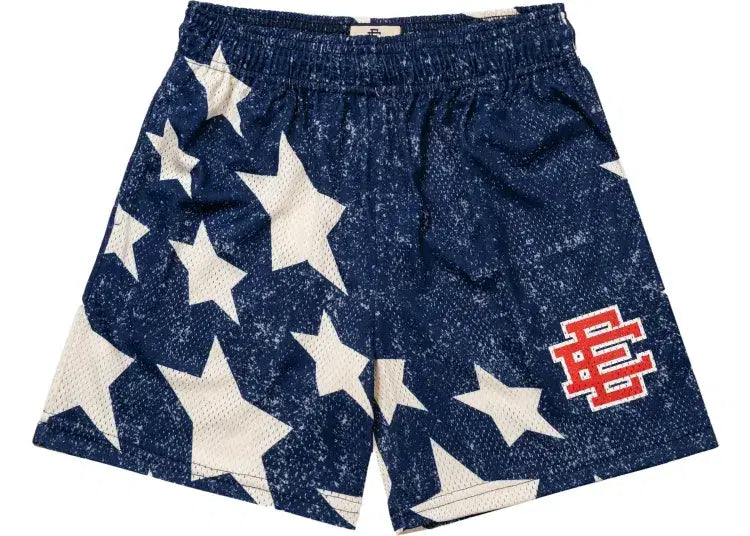 Navy mesh shorts with white star pattern and red embroidered patch, streetwear style