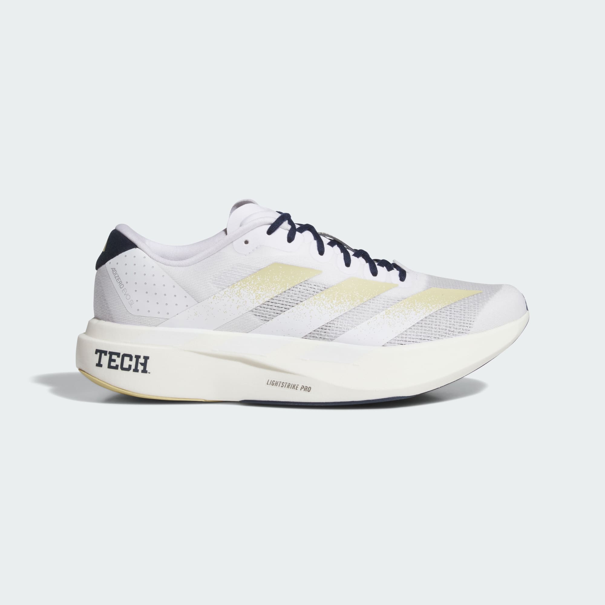 White running shoe with yellow accents on a white background