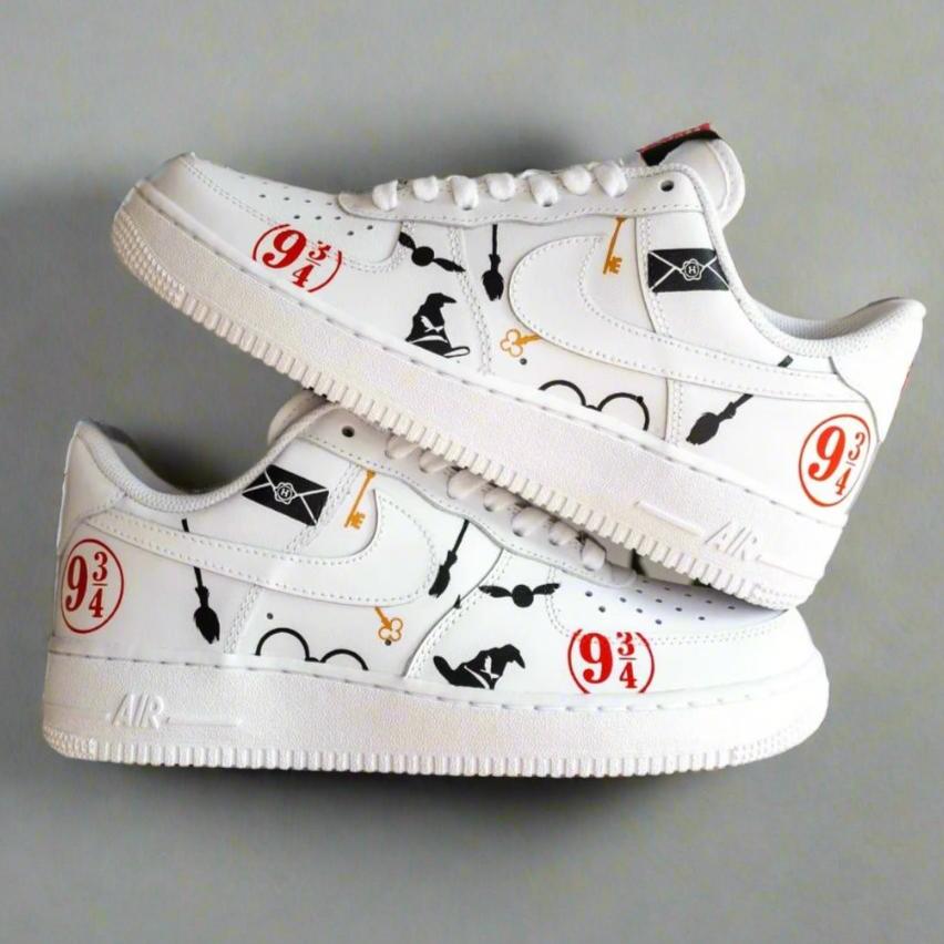 White custom Air Force 1 sneakers with Harry Potter-themed graphics, icons, and platform 9 3/4 details.