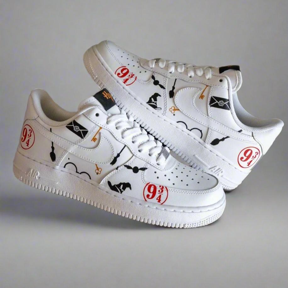 White custom sneakers with wizard-themed graphics and platform 9 3/4 designs on sides.