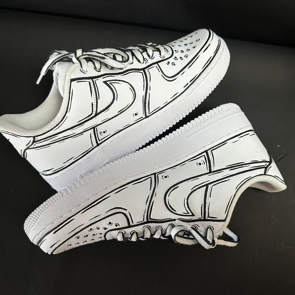 White streetwear sneakers with bold black outline design on a black background