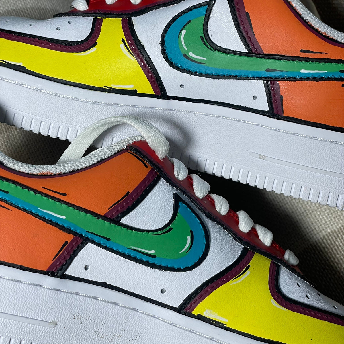 Colorful custom streetwear sneakers with cartoon-style design and vibrant panels