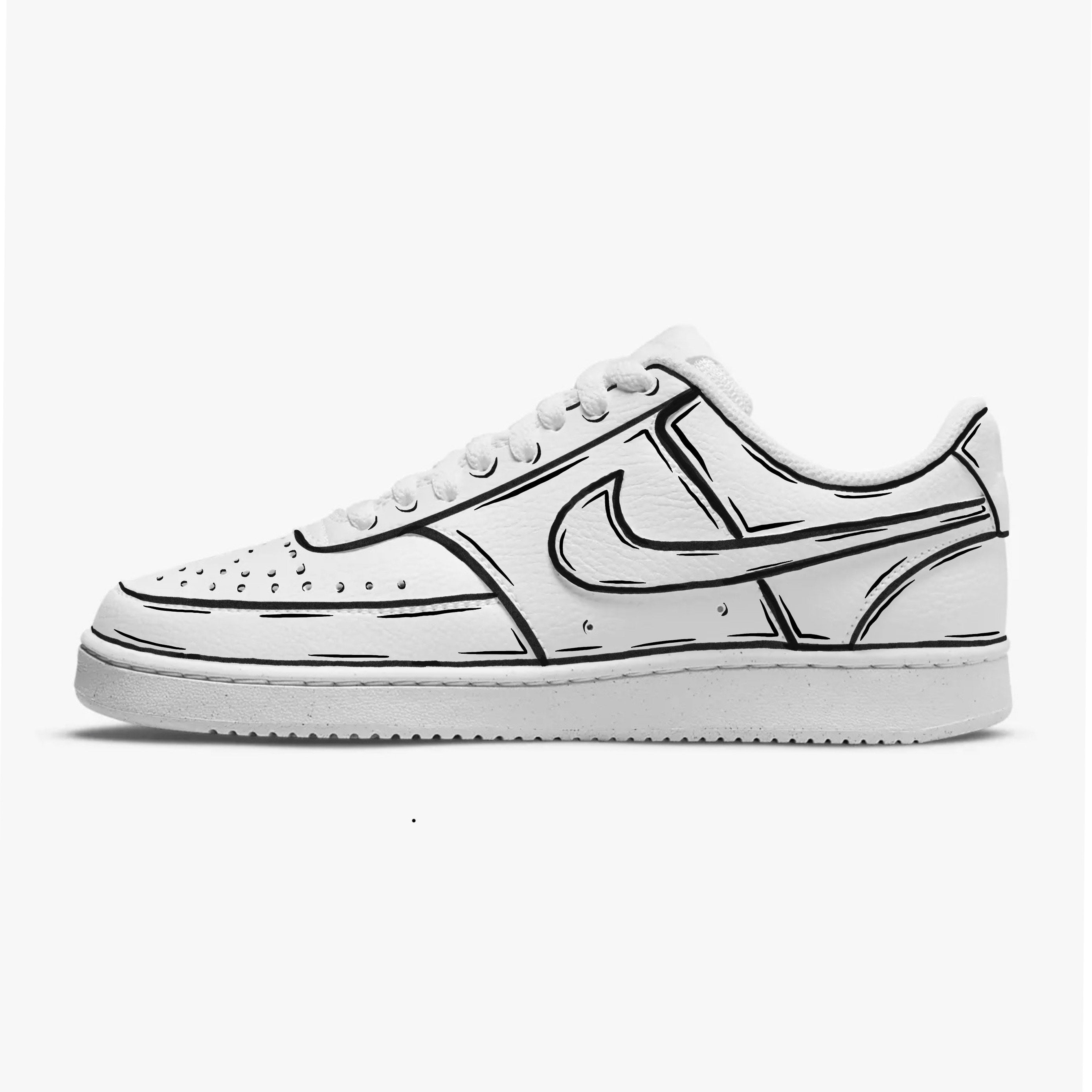 White low-top sneaker with black cartoon-style outlines, streetwear sneaker on white background