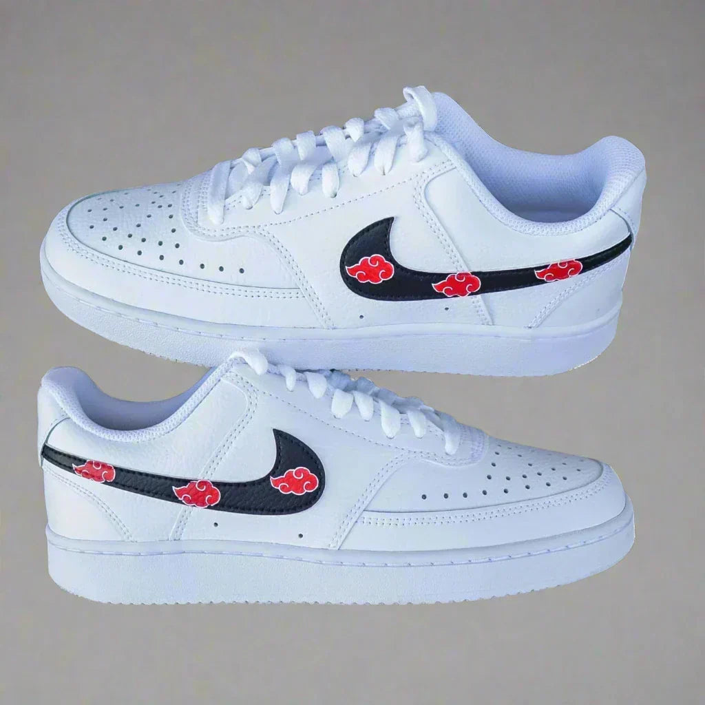 White streetwear sneakers with black swoosh and red cloud pattern, side view