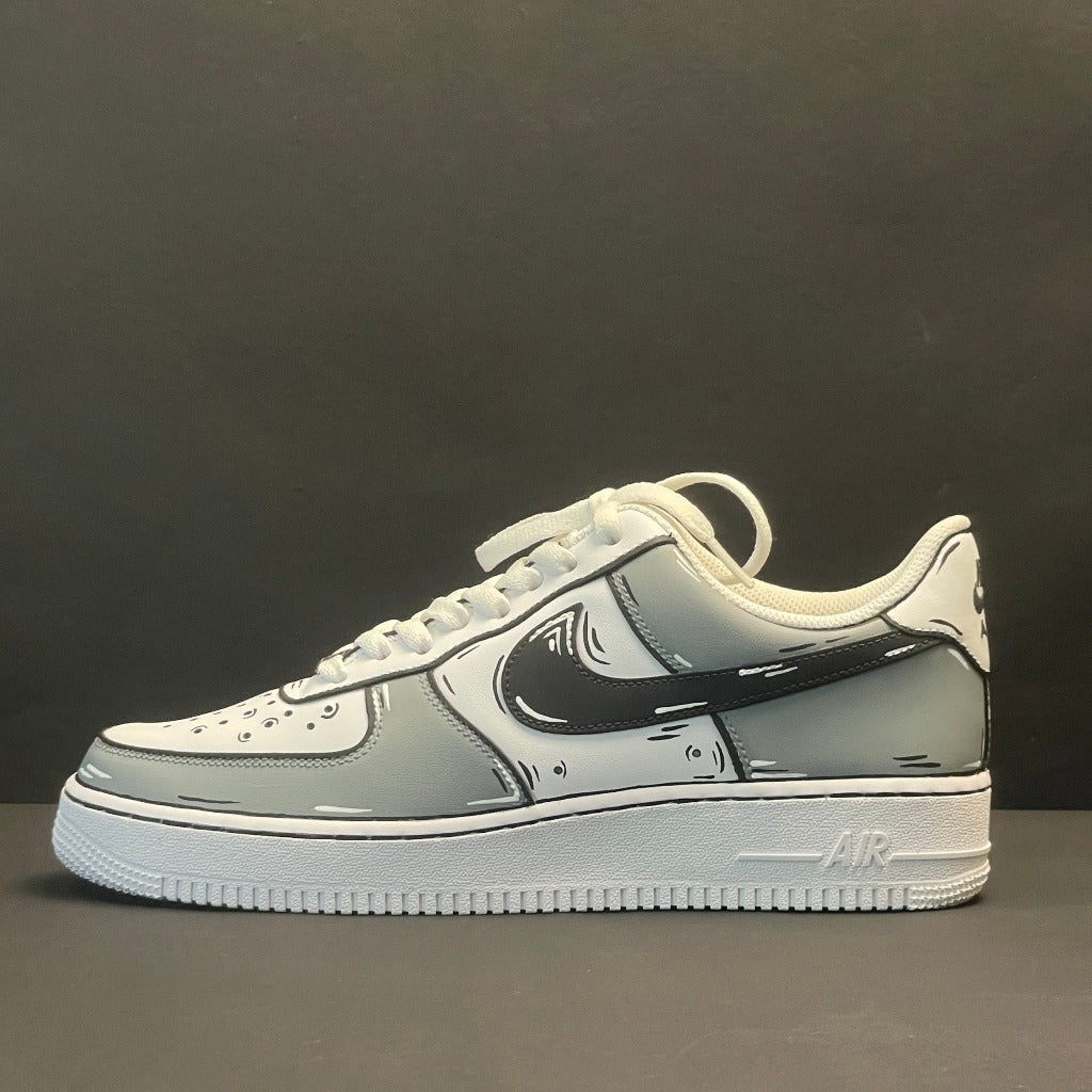 Custom streetwear sneaker with cartoon outline design, grey and white colorway, side view