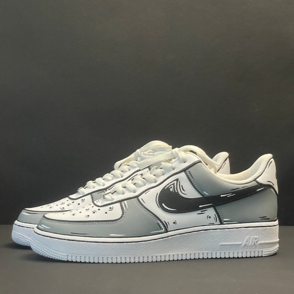 White and grey streetwear sneakers with cartoon-style black outlines, side view