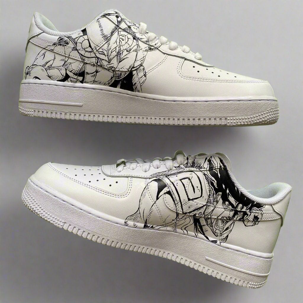 White custom Air Force 1 sneakers with black anime-inspired graphic design on the sides.