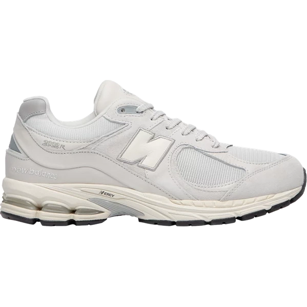 Light grey New Balance 2002R sneaker with mesh and suede upper, visible side logo, and sporty sole.