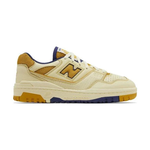 Yellow and cream New Balance sneaker with mesh and suede details, purple and gum sole