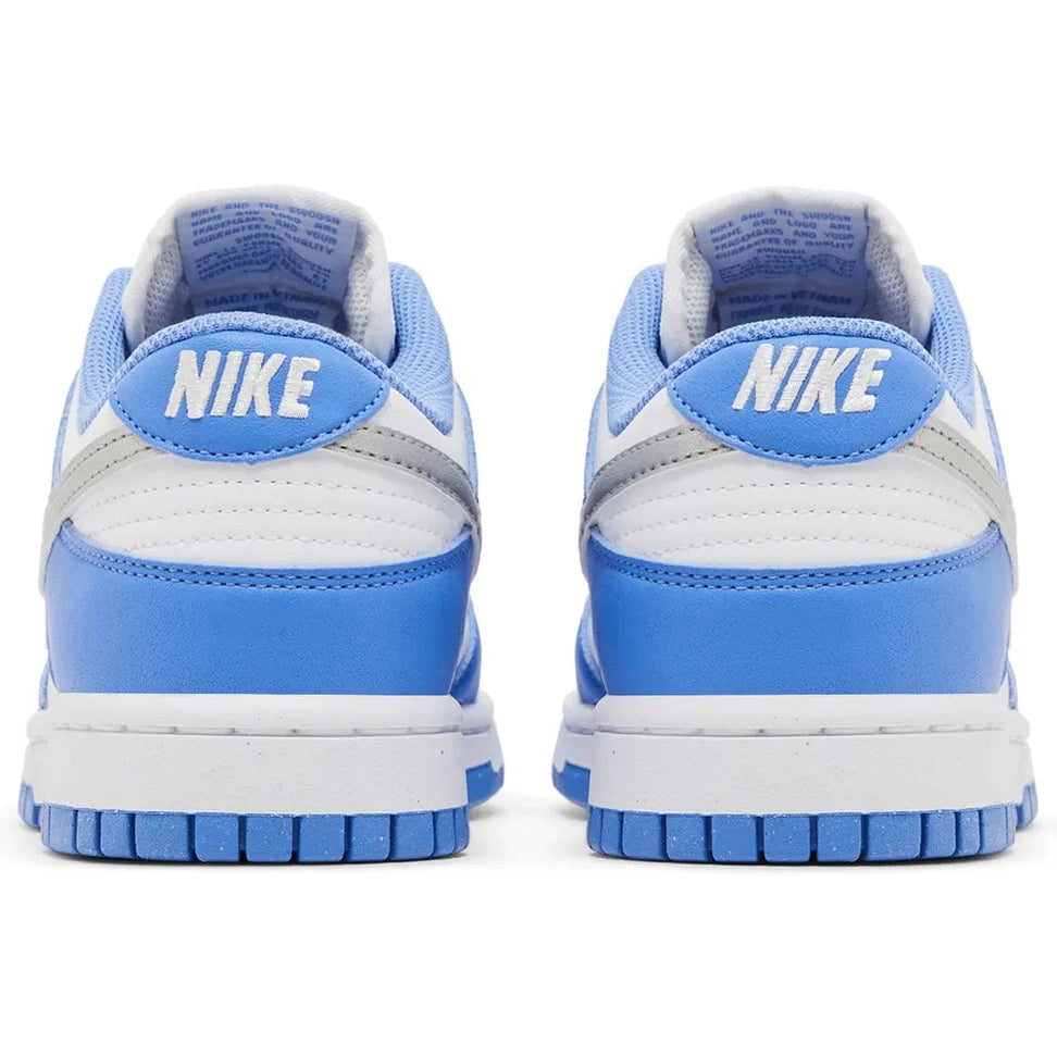 Back view of white and blue Nike Dunk Low sneakers with embroidered Nike logo