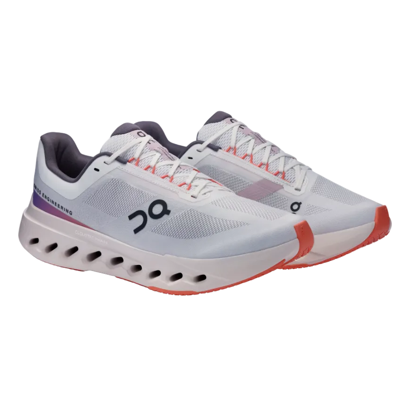 White athletic running sneakers with mesh panels, orange accents, cushioned sole, side logo