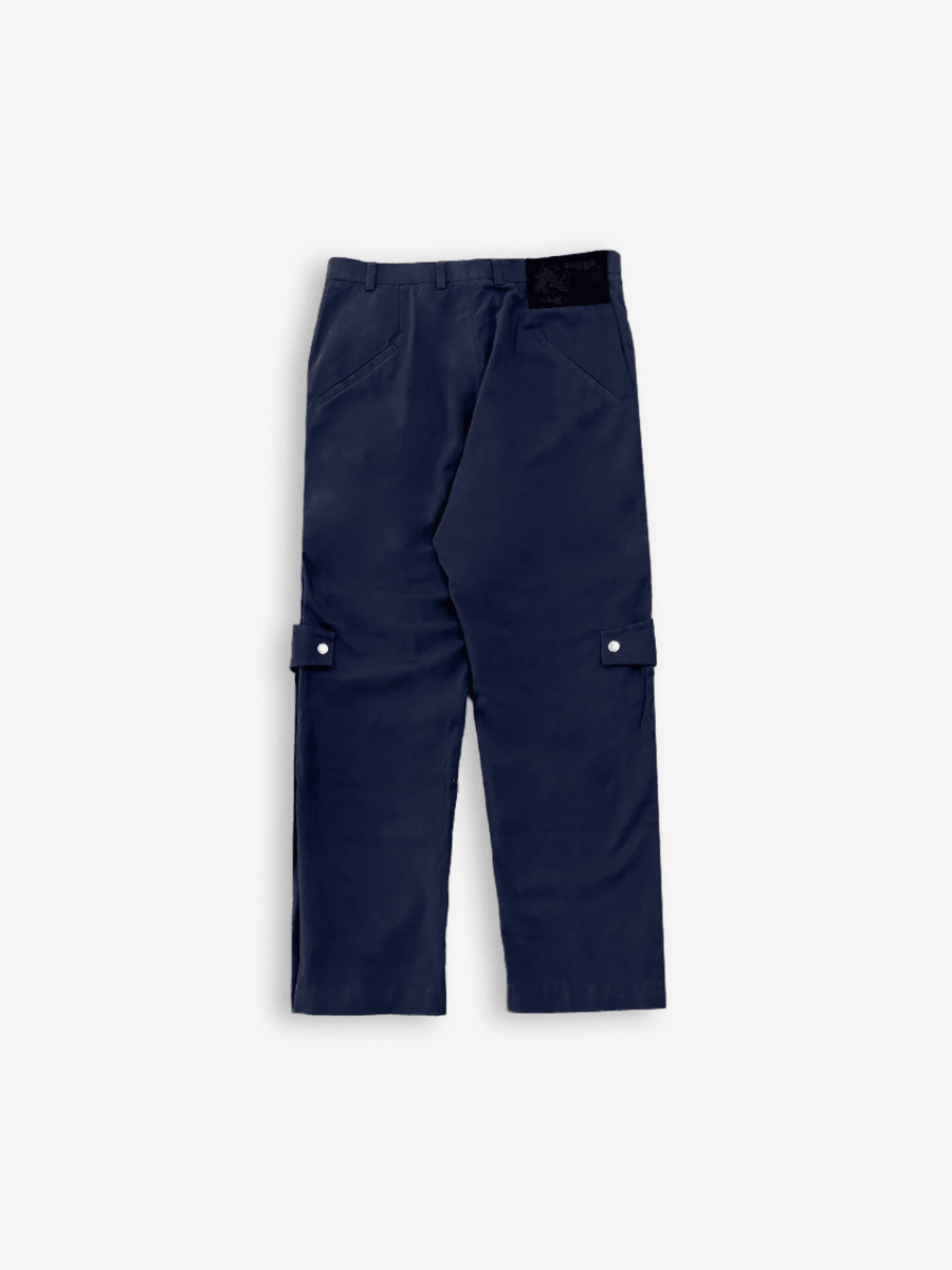 Navy blue pleated knee cargo pants with flap pockets and button details, streetwear style