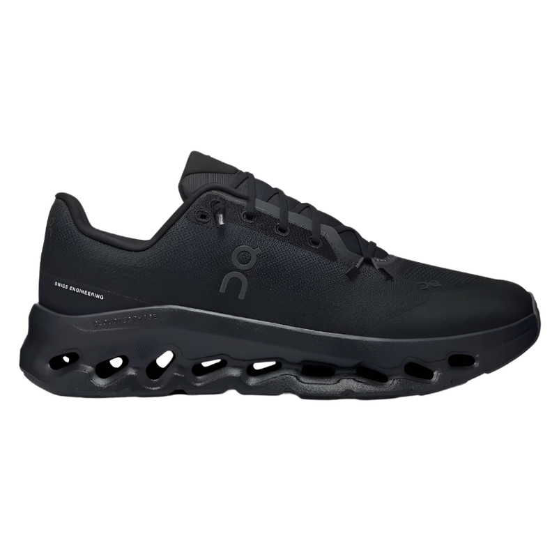 All-black designer sneaker with perforated chunky sole and minimalist streetwear style