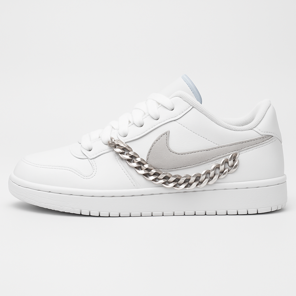 White sneaker with a silver chain on a light gray background