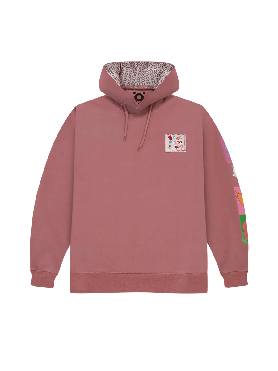 Pink graphic streetwear hoodie with patterned hood lining and colorful sleeve patch.