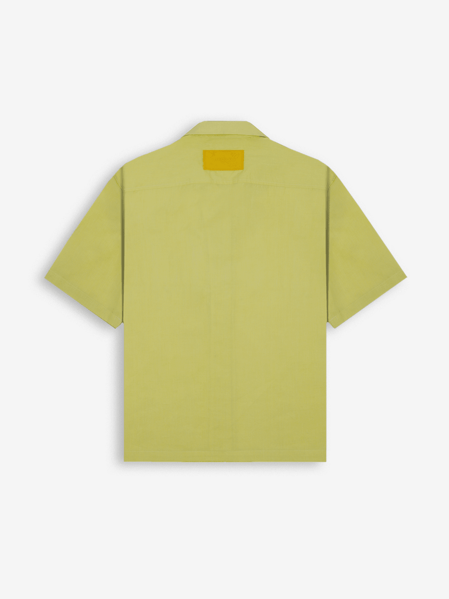 Light yellow short sleeve button-up shirt with a yellow patch on the upper back, streetwear style