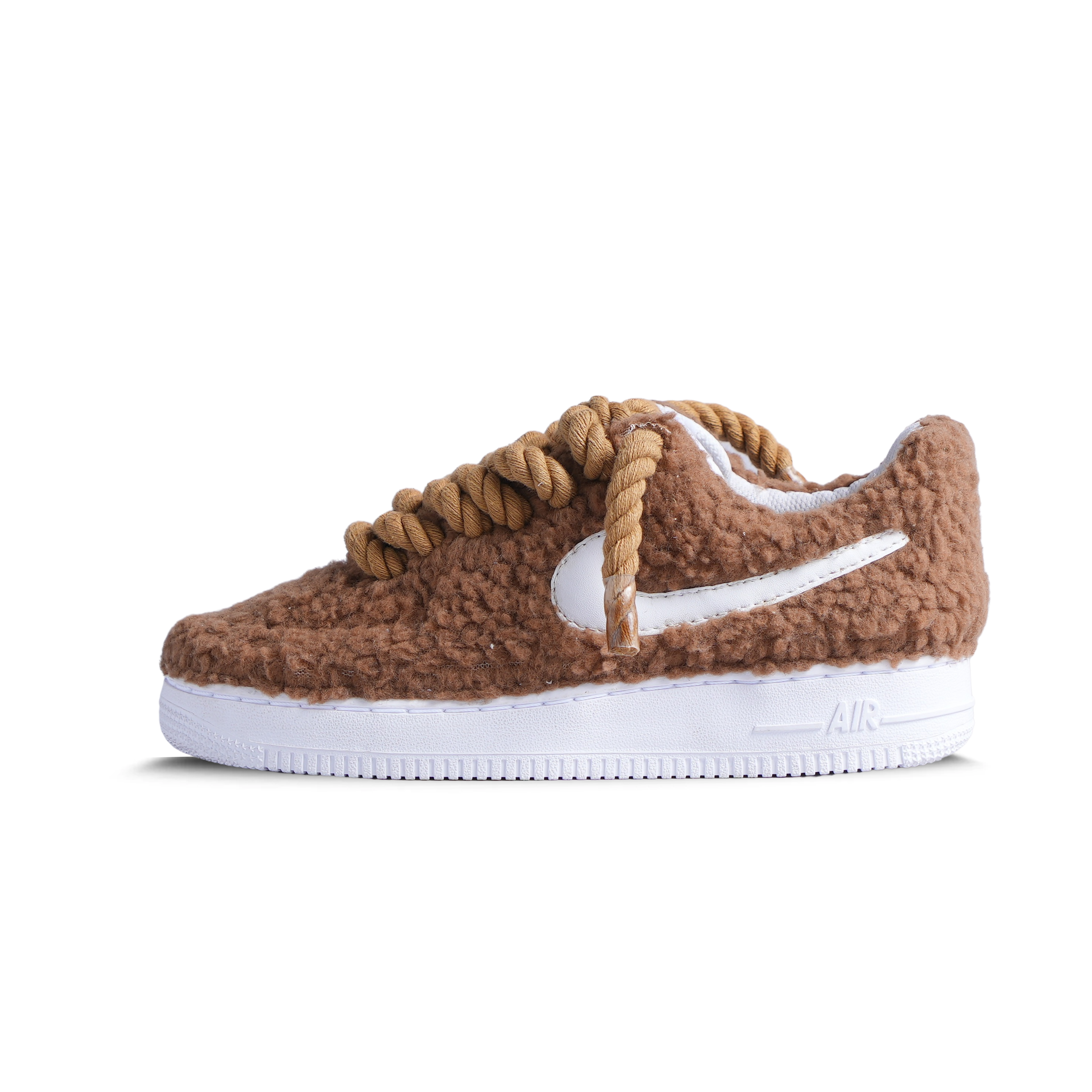 Brown sherpa textured sneaker with chunky rope laces, white swoosh, and white sole