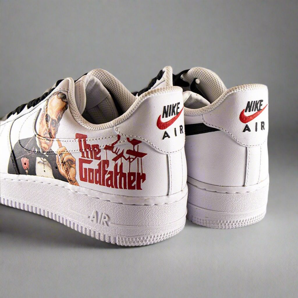 Custom white Nike Air Force 1 sneakers with The Godfather graphic and red text on the side.
