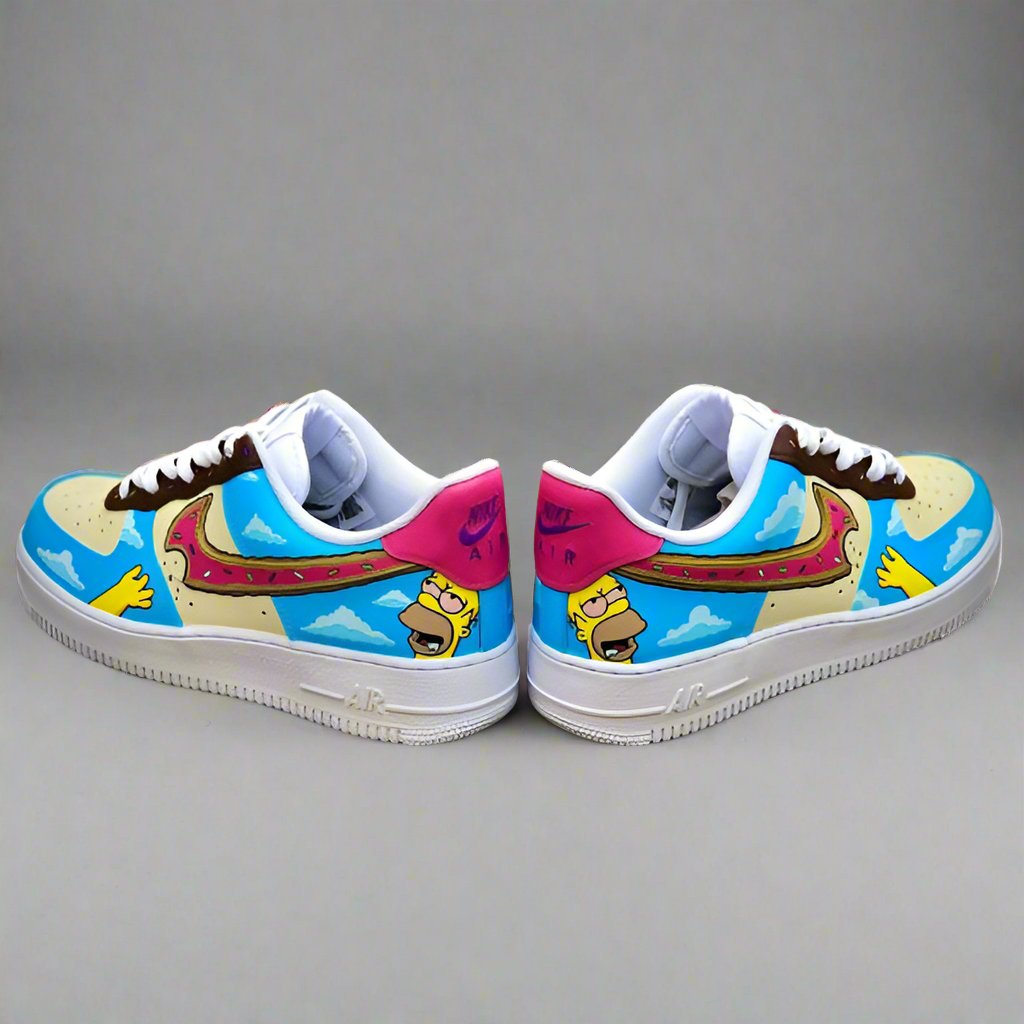 Custom Air Force 1 sneakers with cartoon-inspired artwork, bright blue sky and donut swoosh design.