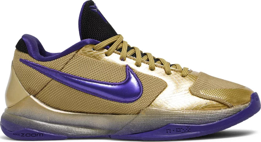 Gold and purple low-top sneaker with textured panels and Nike Zoom branding