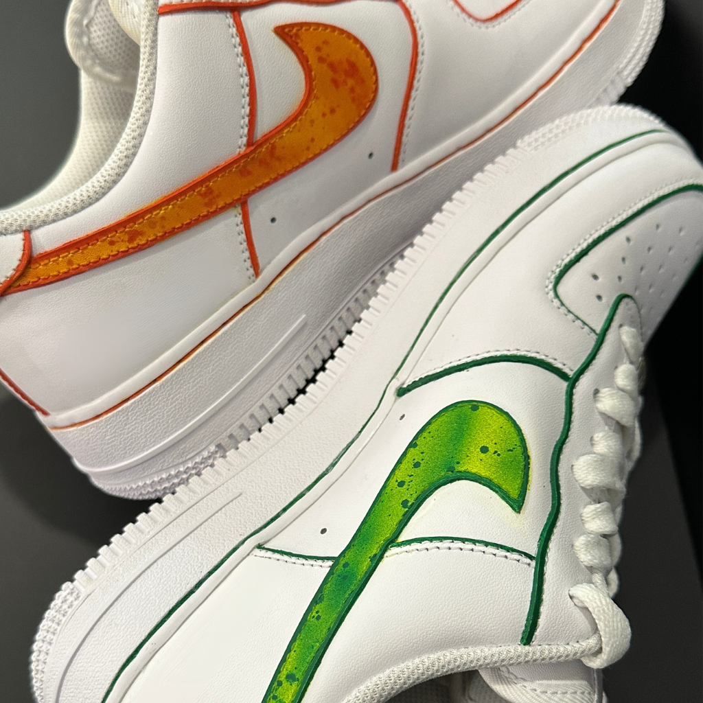 White sneakers with orange and green swoosh details, streetwear sneakers close-up