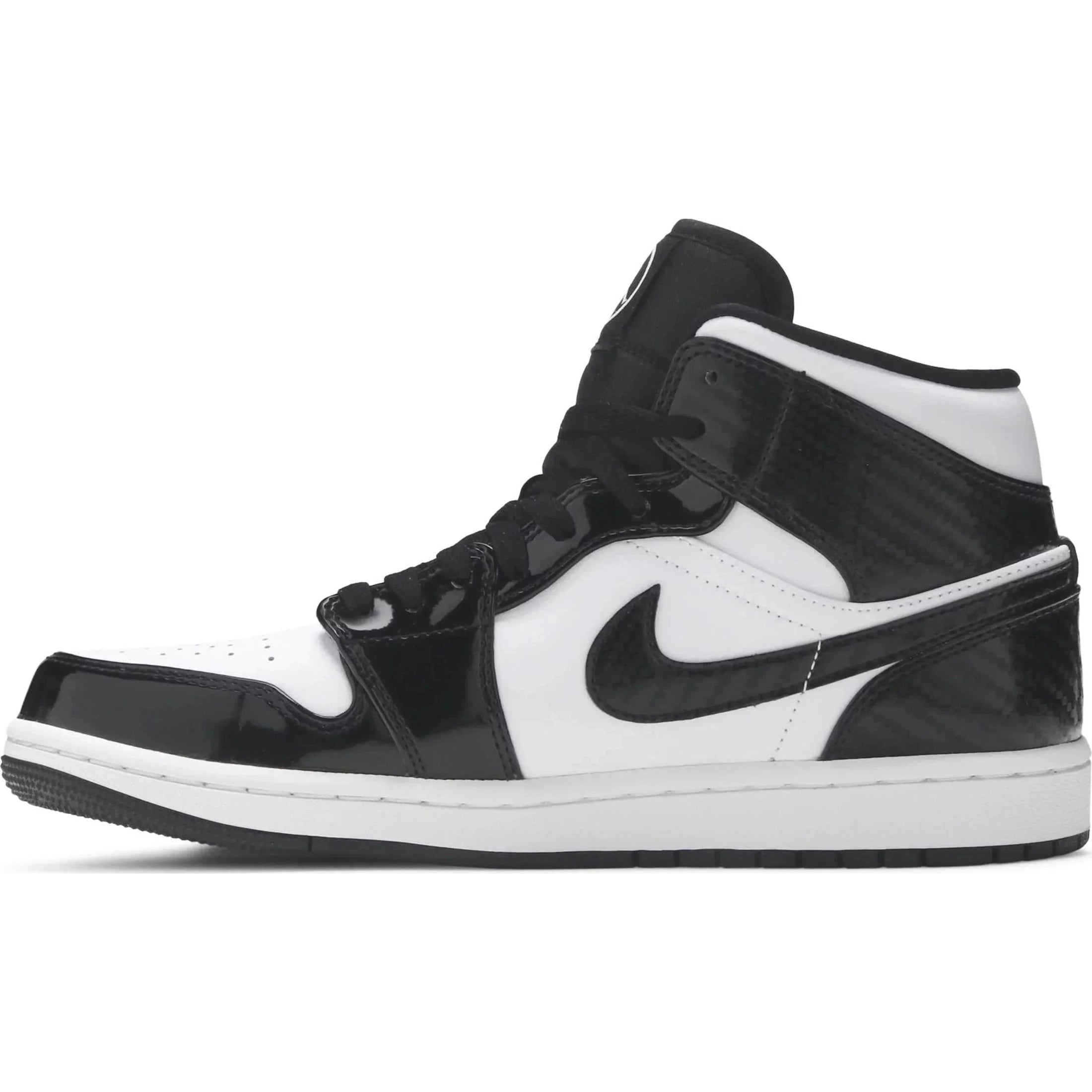 Black and white mid-top sneaker with patent leather details and Nike Swoosh logo