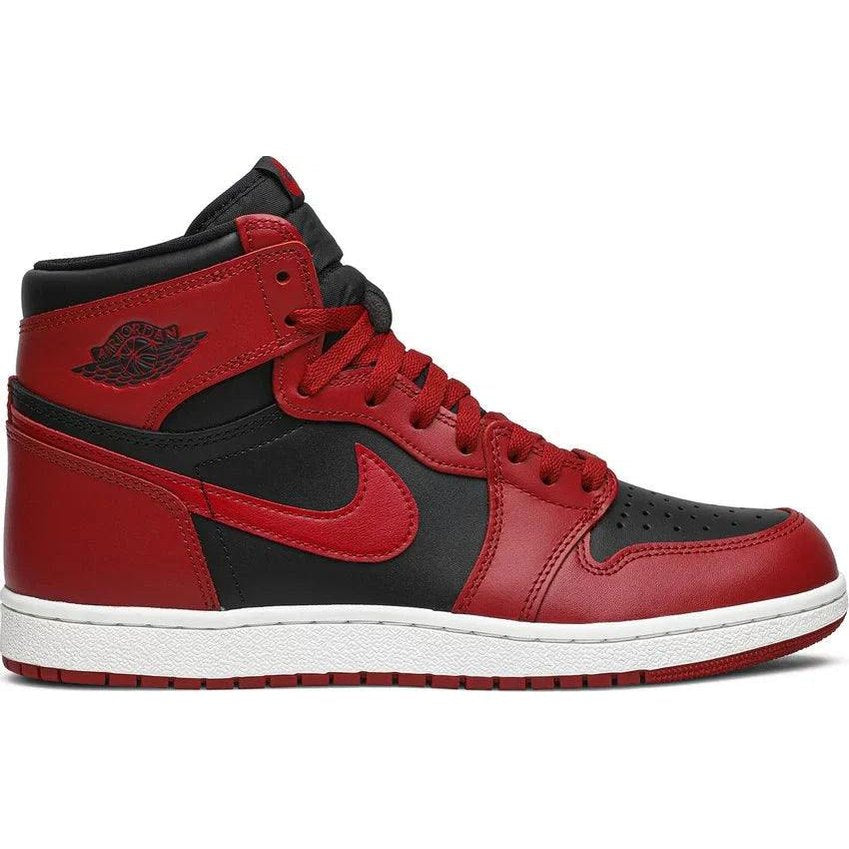 Black and red high-top sneaker with white sole, leather upper, and perforated toe box