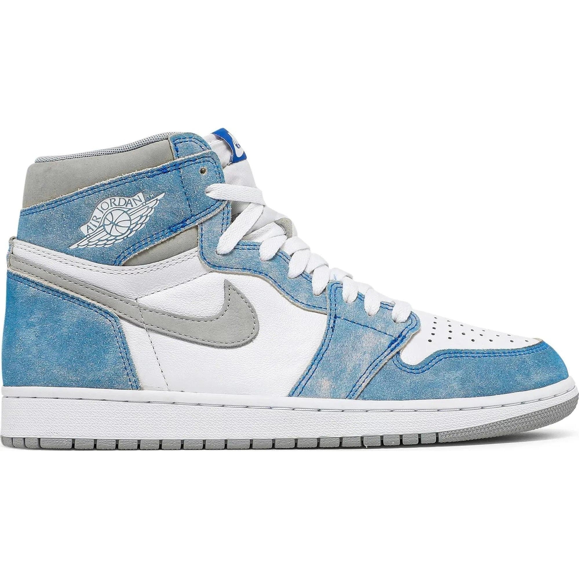 White and blue high-top sneaker with suede overlays, grey swoosh, and Air Jordan wings logo