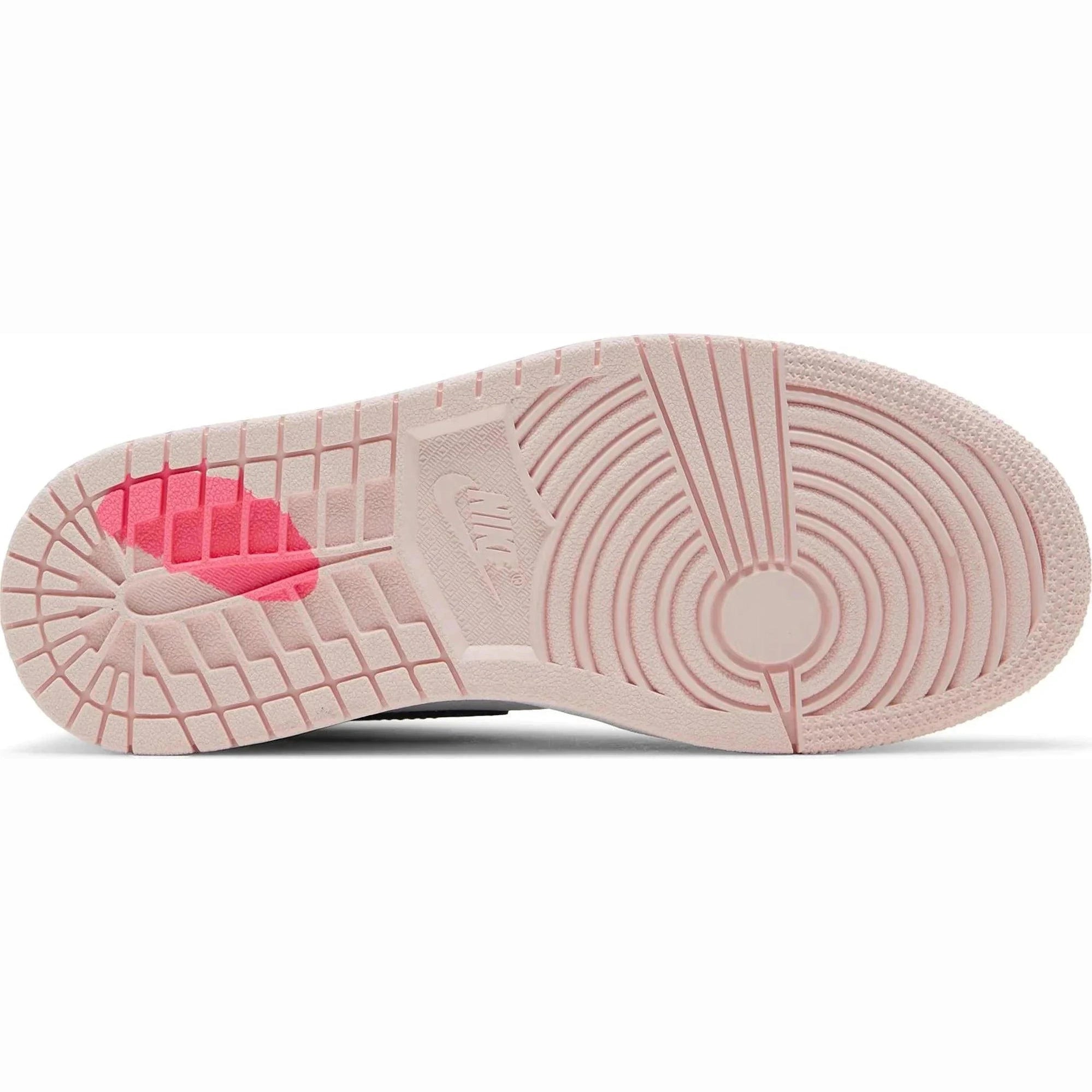 Pink rubber outsole of a retro high top sneaker with translucent pink detail and textured grip.