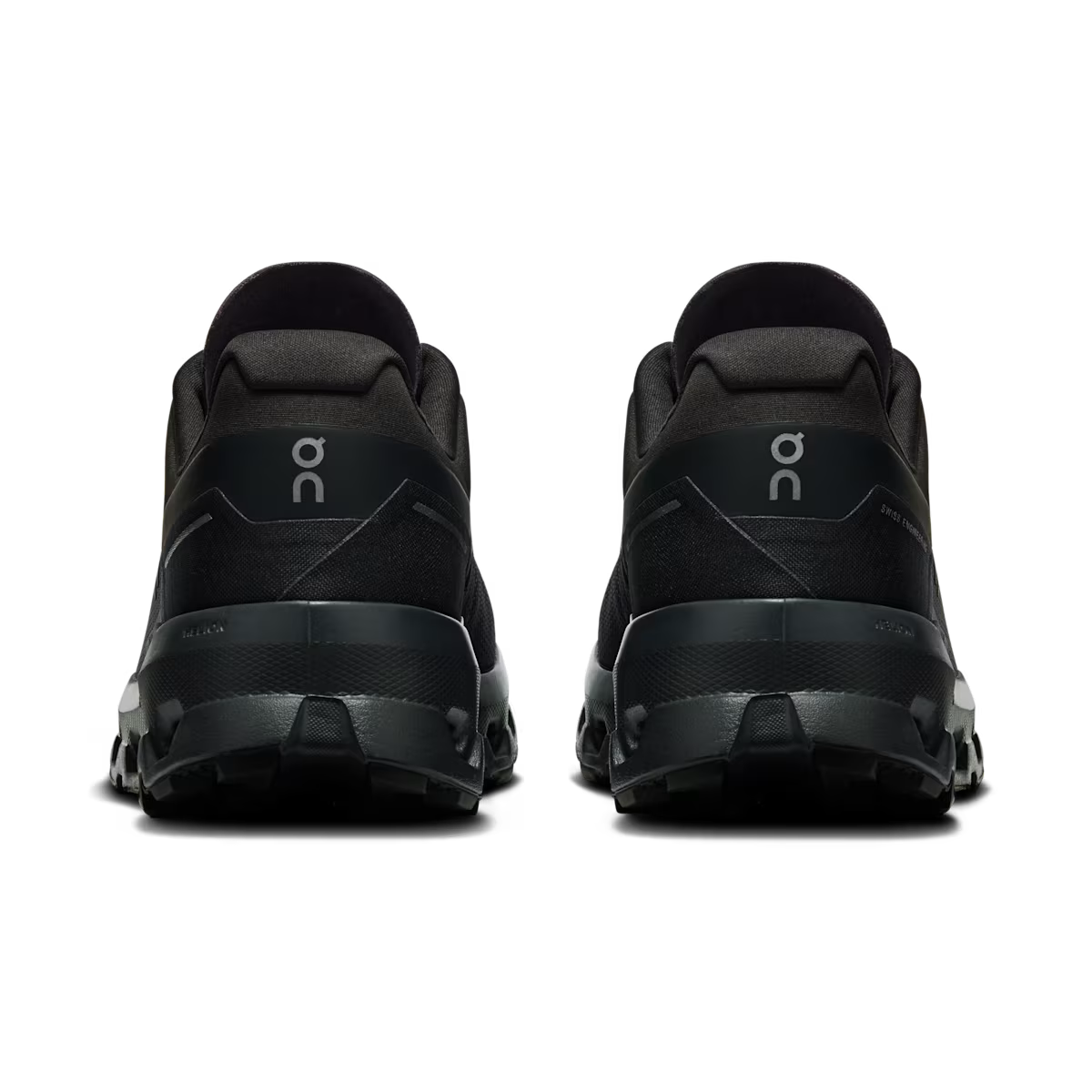 Back view of black athletic sneakers with rugged soles, On logo, streetwear footwear