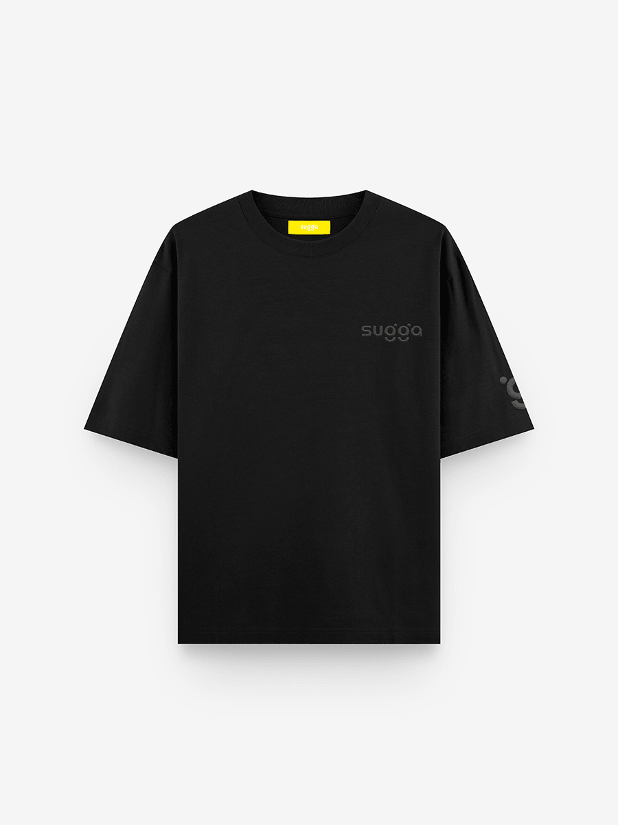 Black oversized streetwear t-shirt with subtle 'sugga' logo on chest and sleeve, front view