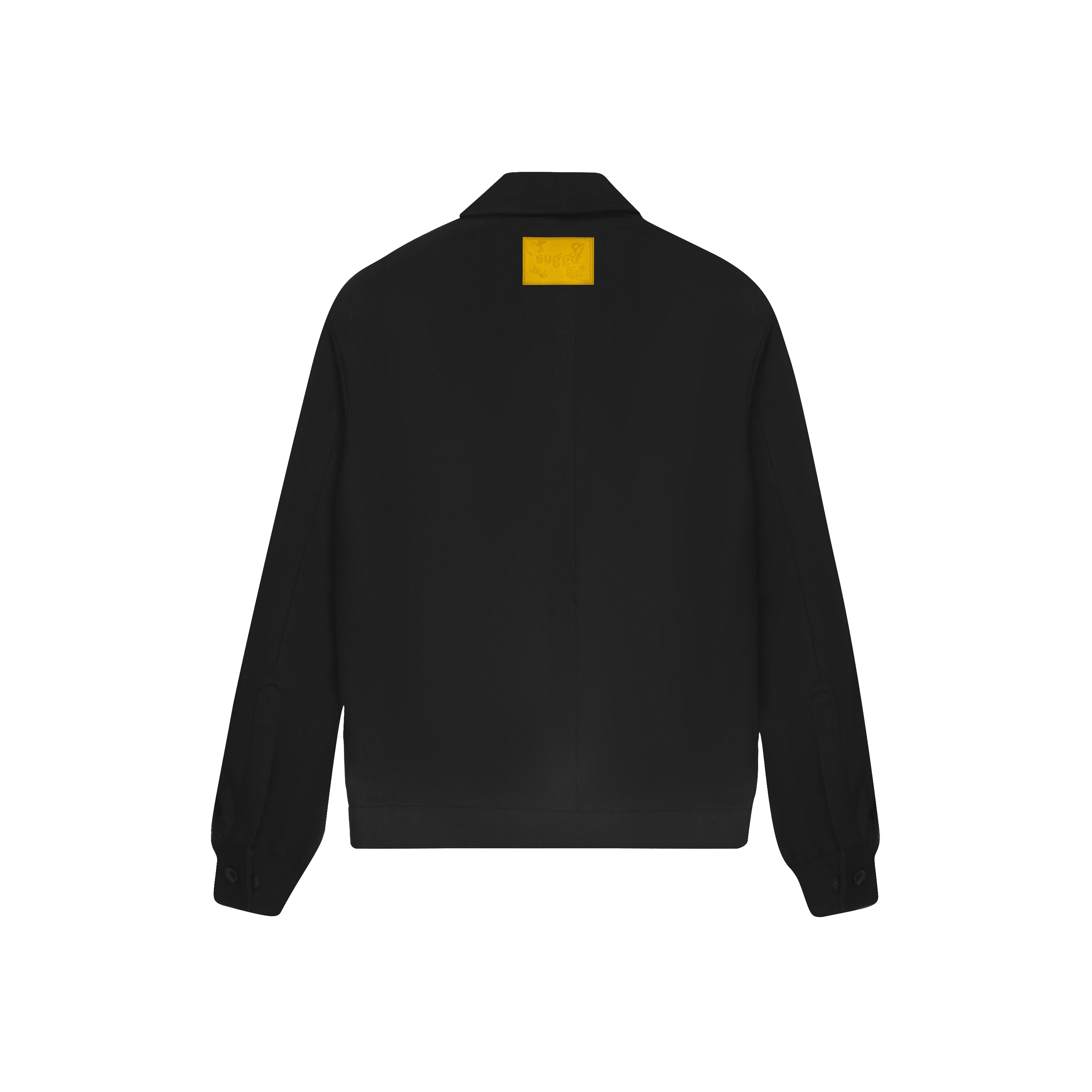 Black streetwear jacket with yellow patch on back, long sleeves, and button cuffs