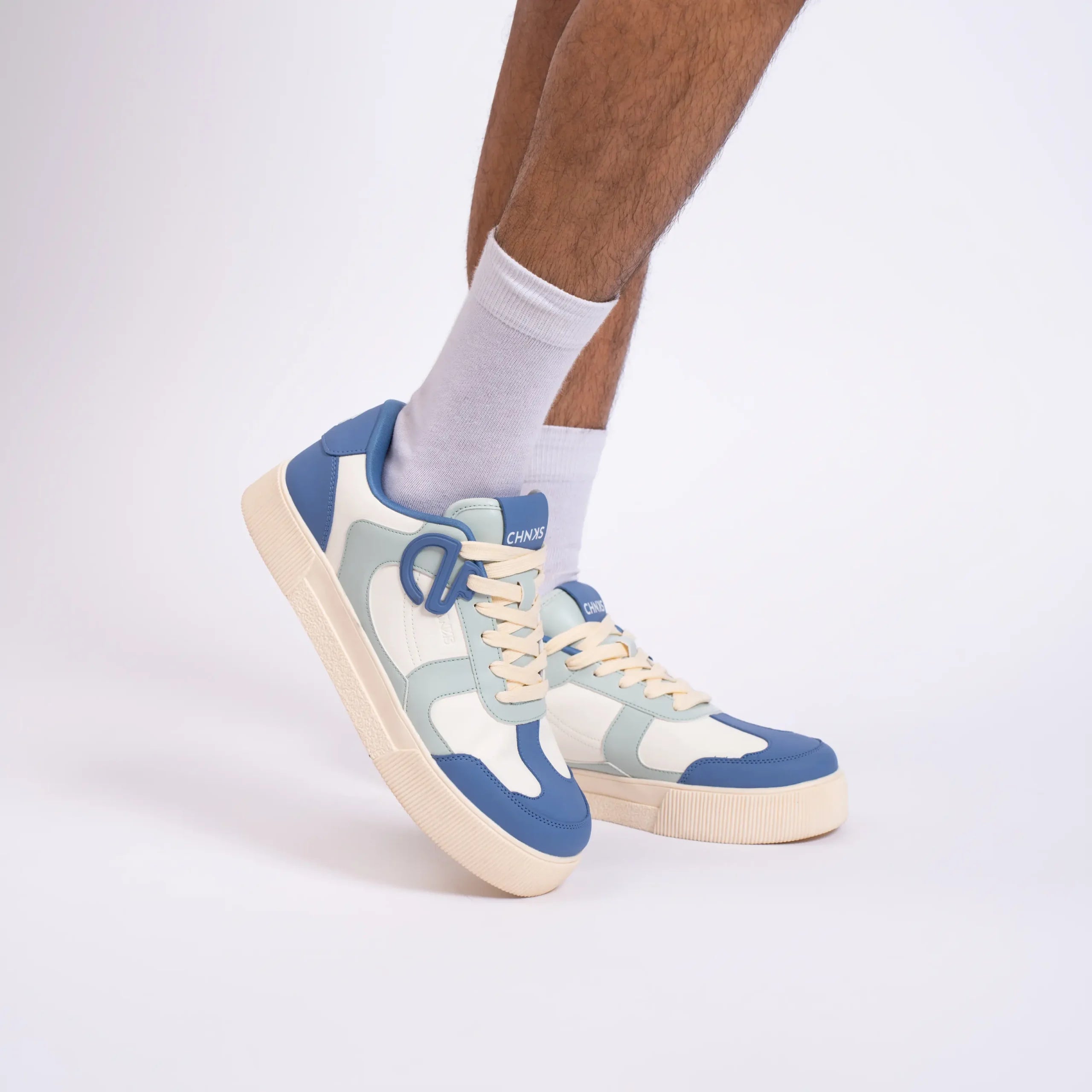 Atlantis CHNKS sneakers on men’s feet – blue sneakers for daily wear and modern casual looks