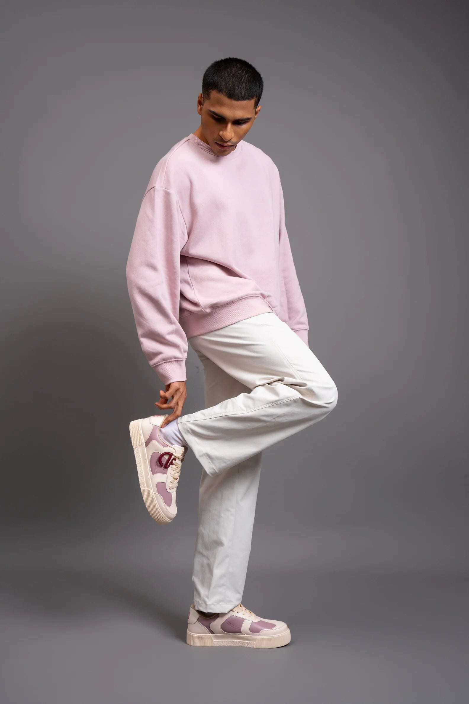 Man wearing Bubblegum CHNKS pink and white sneakers with pink hoodie and white trousers – casual sneakers for men