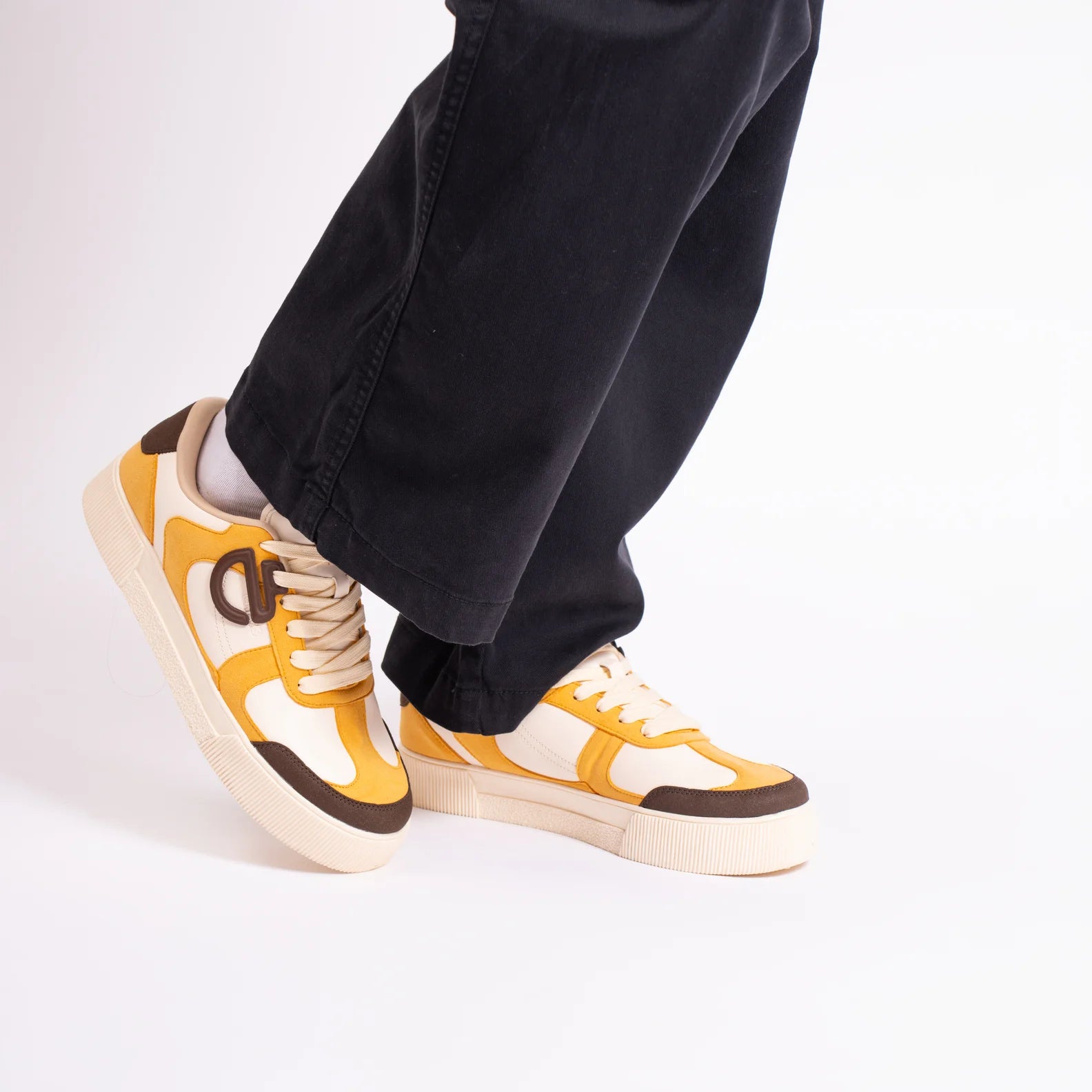 Buttercotch CHNKS sneakers – lifestyle image of yellow sneakers for men and women