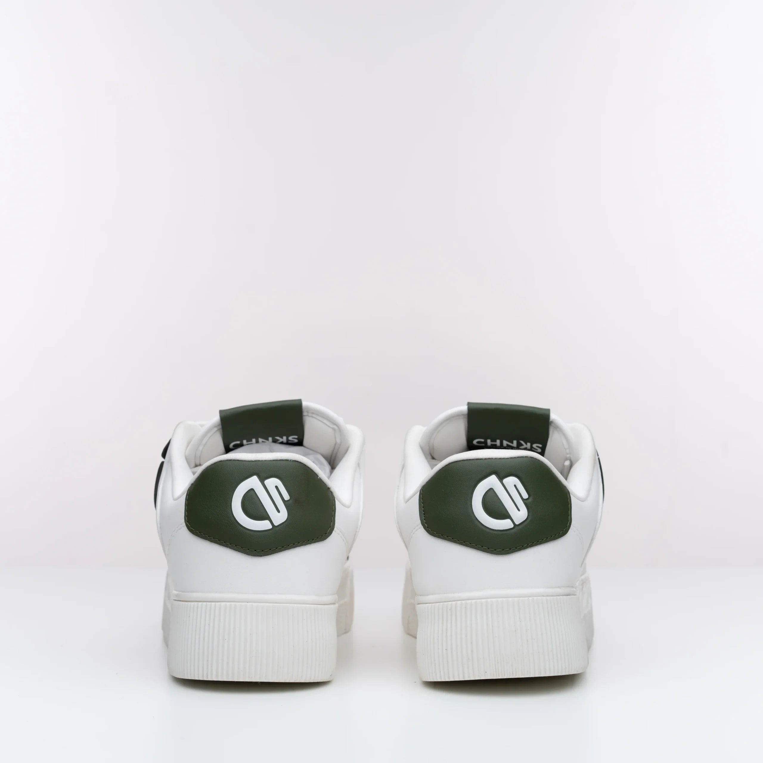 Back view of Icy CHNKS sneakers with CHNKS logo – white sneakers with green heel accent