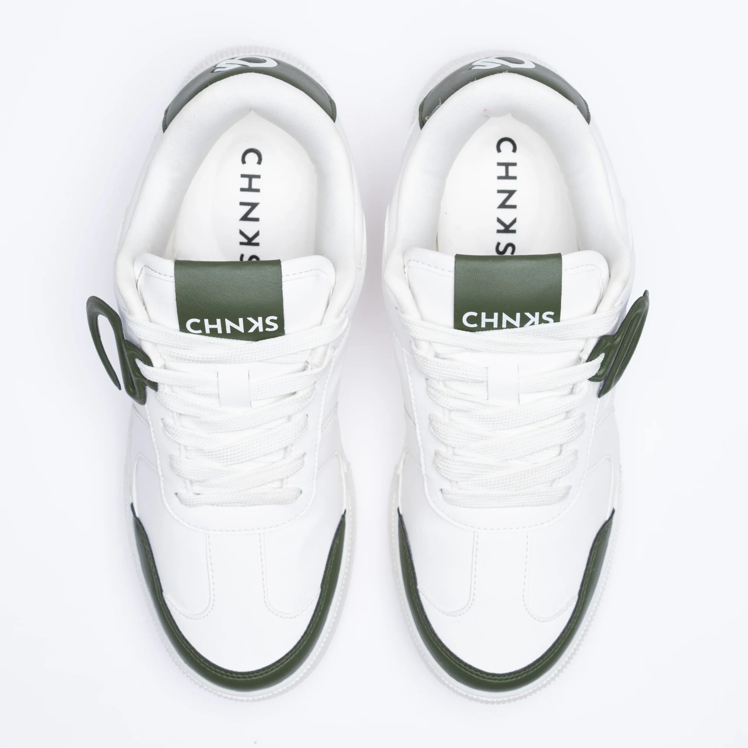 Top view of Icy CHNKS sneakers – breathable white upper with green detailing