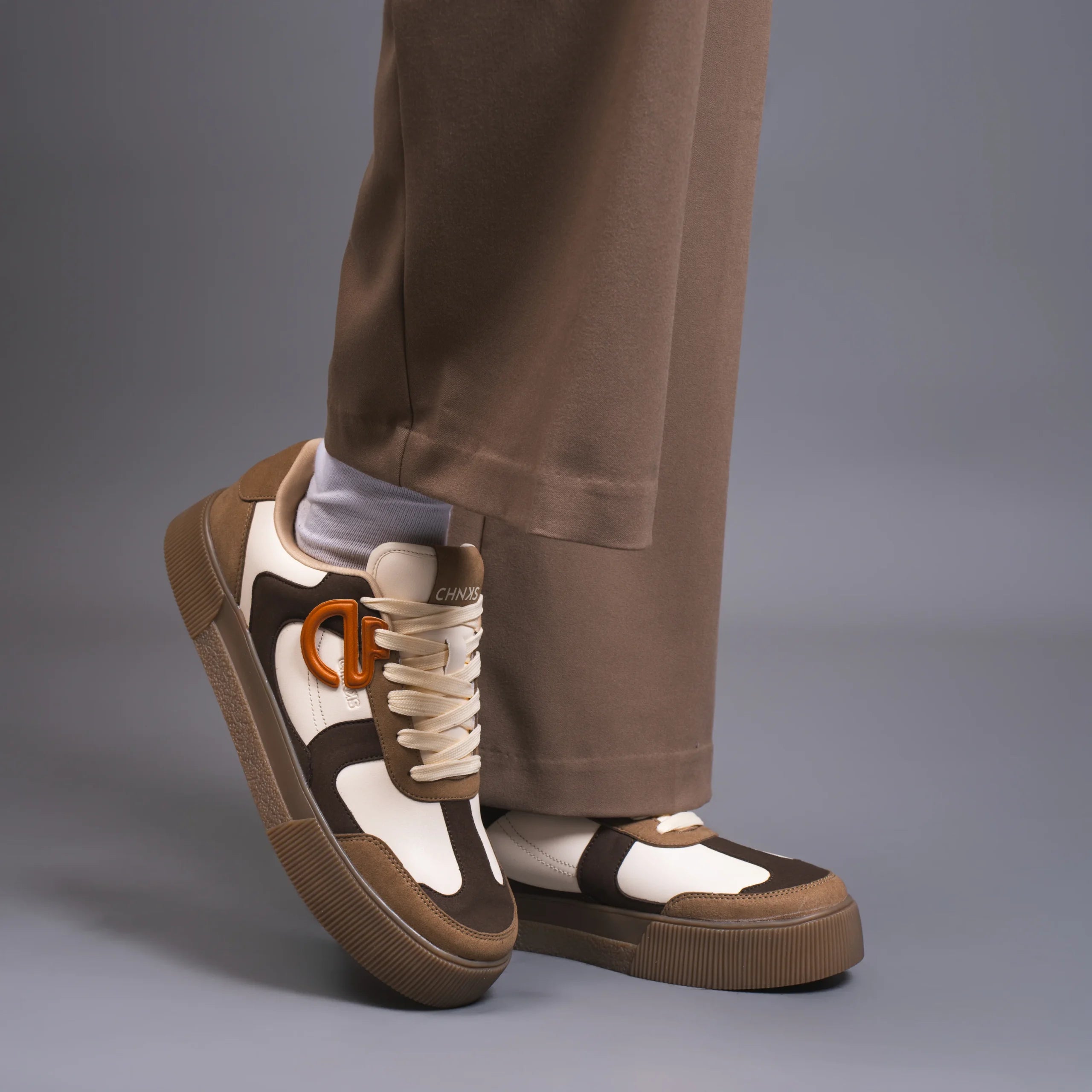 Mocha CHNKS brown sneakers worn with brown trousers – casual streetwear style