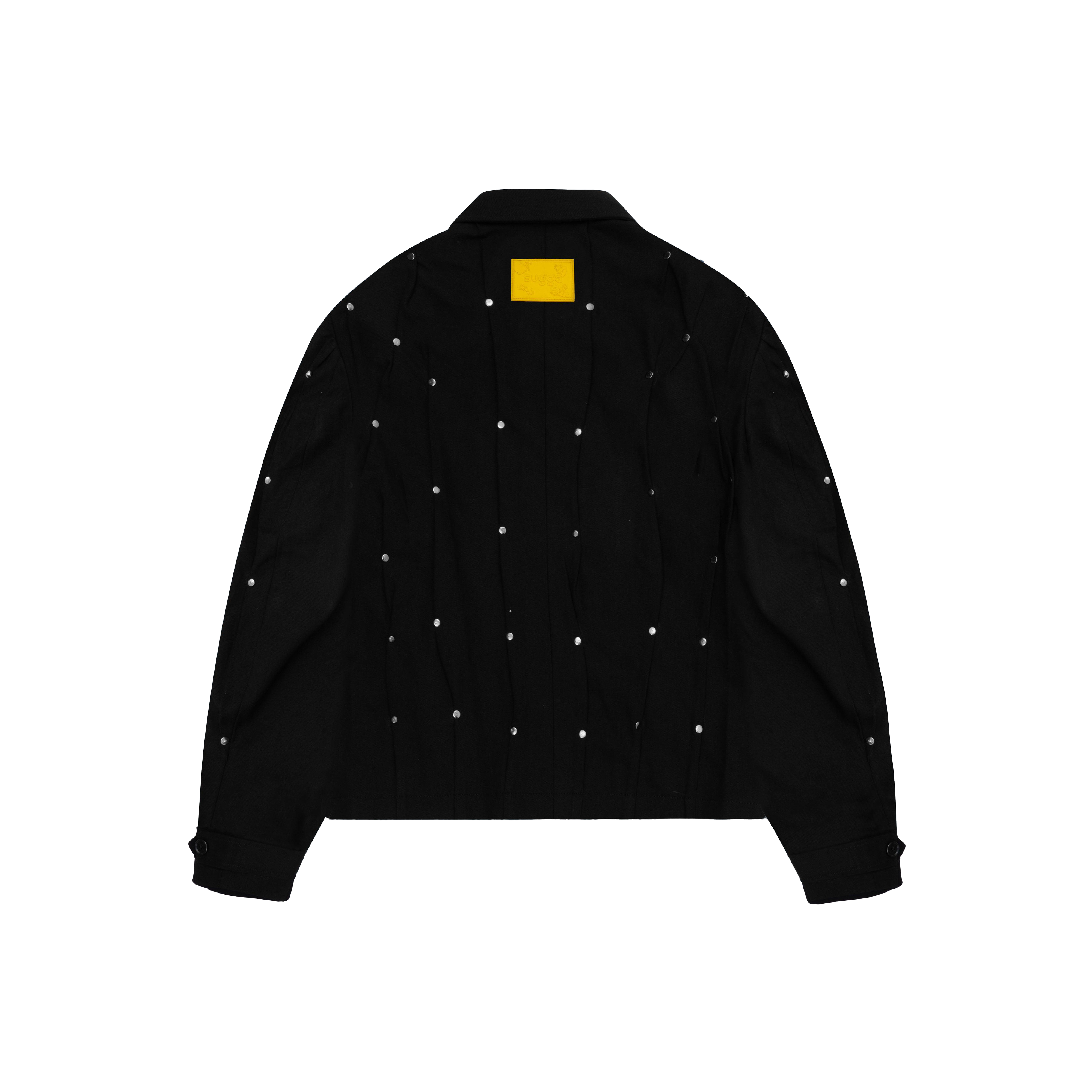 Black streetwear jacket with silver rivet accents and a yellow patch on the back.