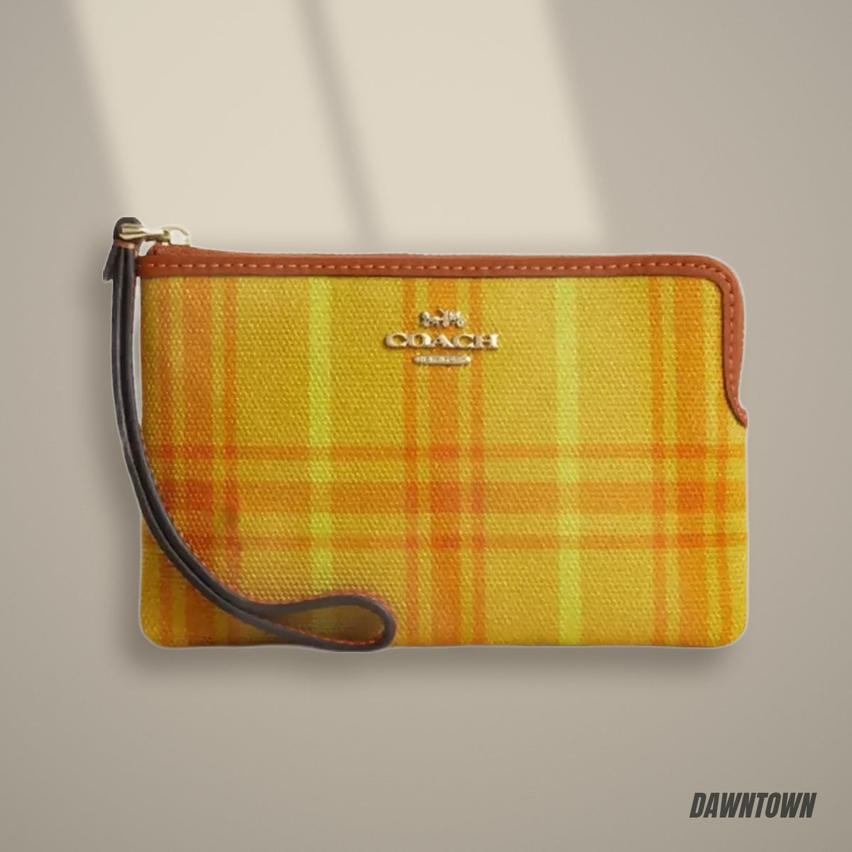 Lifestyle — Coach Corner Zip Wristlet In Regenerative Cotton With Plaid Print in Gold Burnished Amber