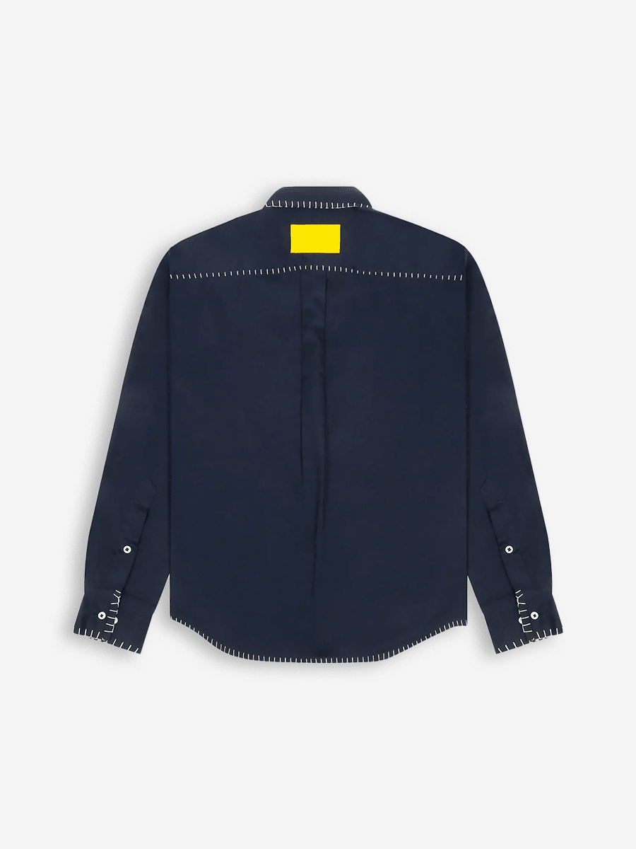 Navy blue long sleeve shirt back view with white flatlock stitching and yellow patch detail