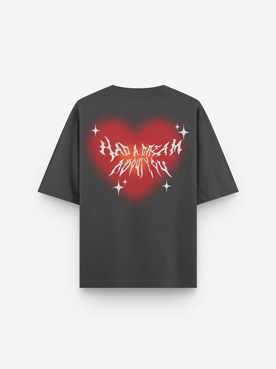 Black streetwear t-shirt with red heart graphic, white stars, and bold text on the back