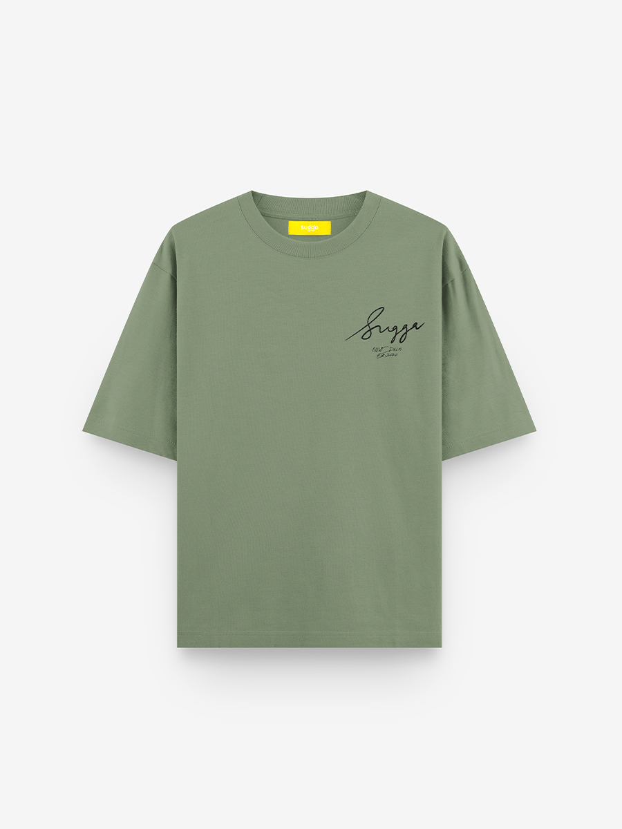 Sage green streetwear t-shirt with subtle chest logo and short sleeves, laid flat on white background
